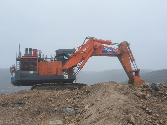 Large mining excavator operating at mine site